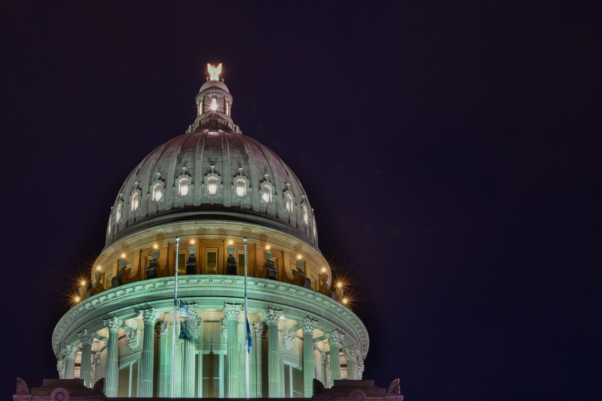 Top of the capitol building at night.