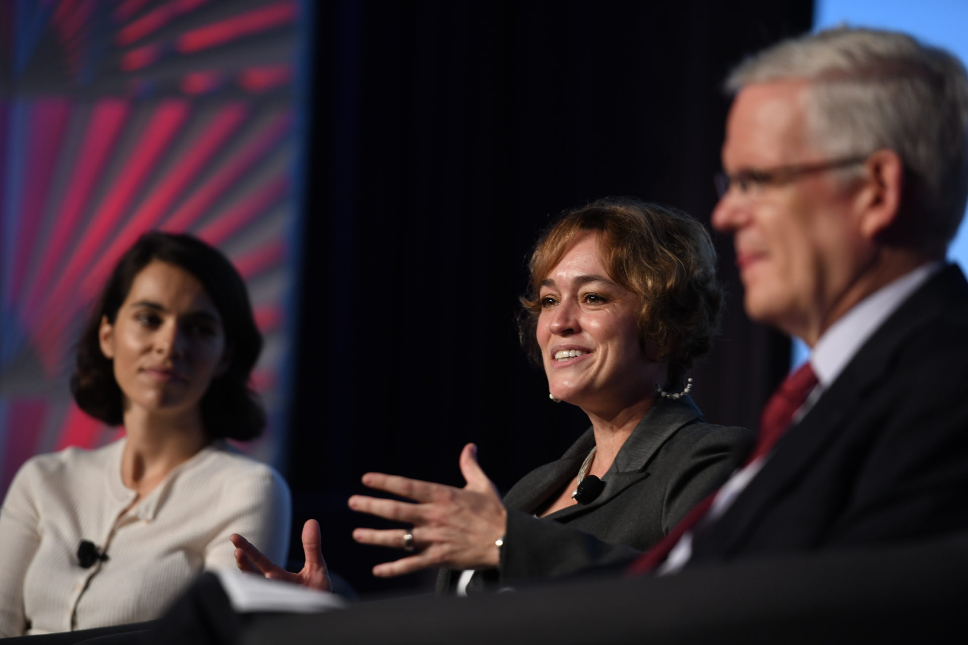 Emily Bove, Shawna Bader-Blau, Sam Worthington on stage at Forum 2018