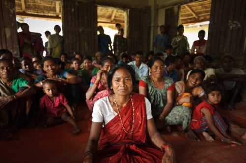 Savitri Devi Chaudry, is a member of the Disaster Preparedness Committee. The committee is part of Mercy Corps' Disaster Risk Reduction program, which aims to reduce the risk of flooding by implementing measures like building up river embankments, planting grass on the embankments to help stabilize the land, and building bamboo spurs to help hold the bank in place. Sirens are also provided for warning the community of any flooding. Kailali, Nepal.