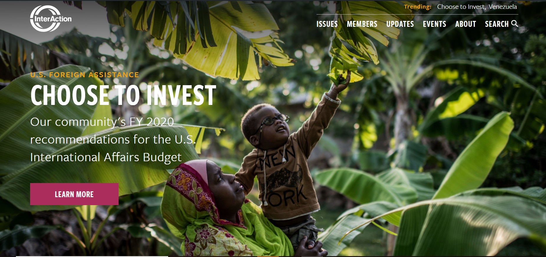 screenshot of interaction homepage: woman holding male child as he reaches for a tree branch. Text overlay on the photo that reads Choose to Invest