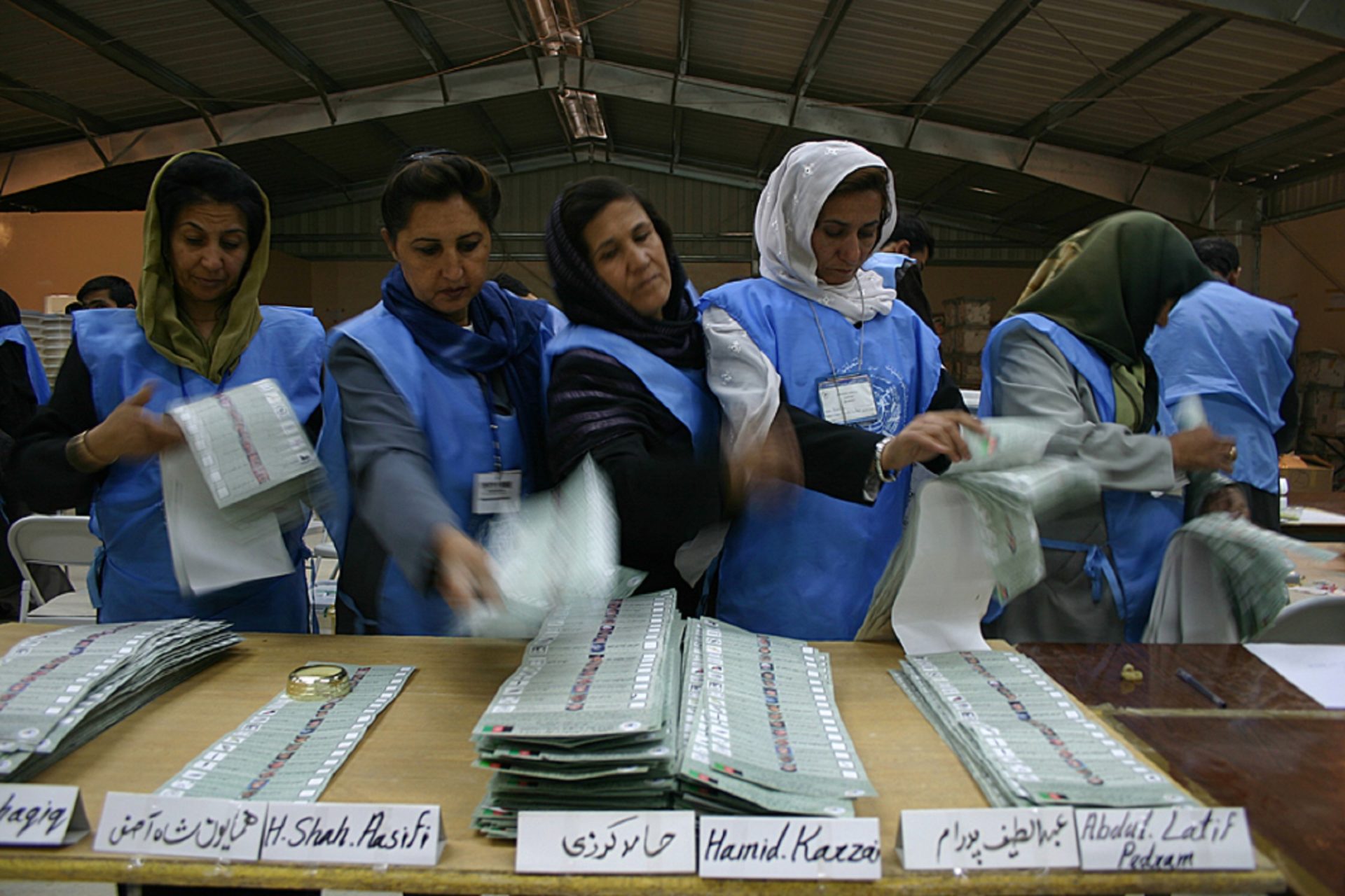 In the Darulamans Counting centre, in Kabul, nine days after the first direct presidential election, October 9, the UN-Afghan JEMB's (Joint Electoral Management Body) employees sort out the ballot papers per candidate from Kabul. Then, the total votes for each candidate are counted and recorded. This operation is called sorting and counting. Among the 10.5 million Afghans registered for the elections, around 8 million people have voted according the first estimations made one week after the vote.